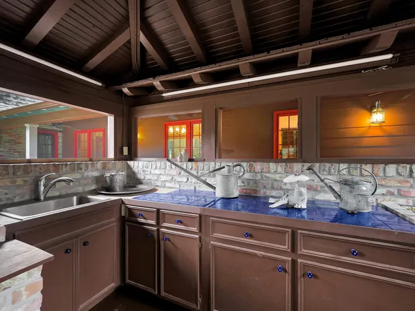 a kitchen with a sink and cabinets