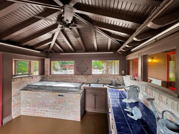 a kitchen with stainless steel appliances granite countertop sink stove and cabinets