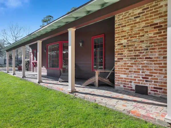 a view of an entrance to house with yard