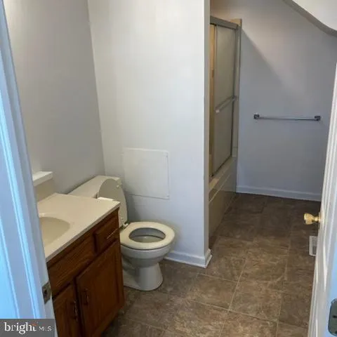 a bathroom with a sink and toilet