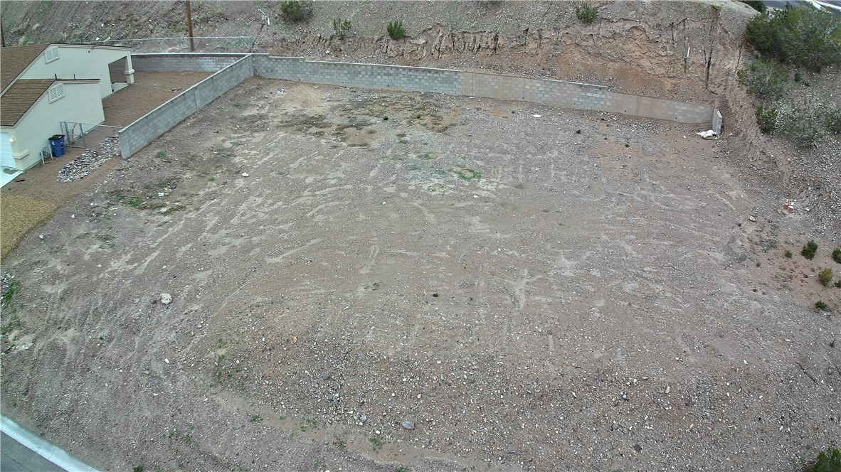 1551 Turquoise Road Bullhead City, AZ 86442 - Photo 3 of 9 a view of a dry yard with wooden floor