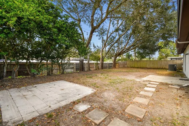 a kitchen with stainless steel appliances a refrigerator sink and microwave