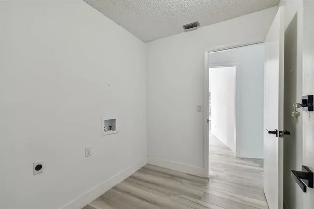 a kitchen with stainless steel appliances a refrigerator sink and cabinets