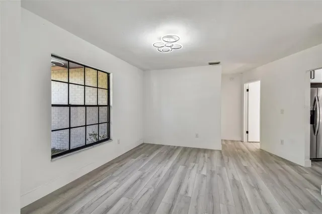 an aerial view of a house with swimming pool and big yard