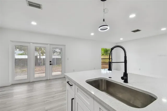 a house with swimming pool in front of it