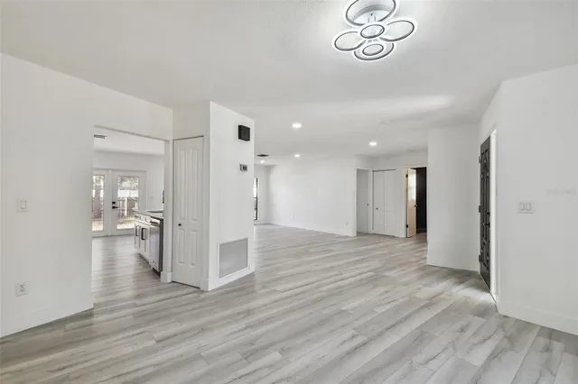 a front view of house with yard and trees