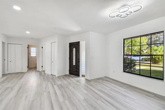 a view of a kitchen and wooden floor