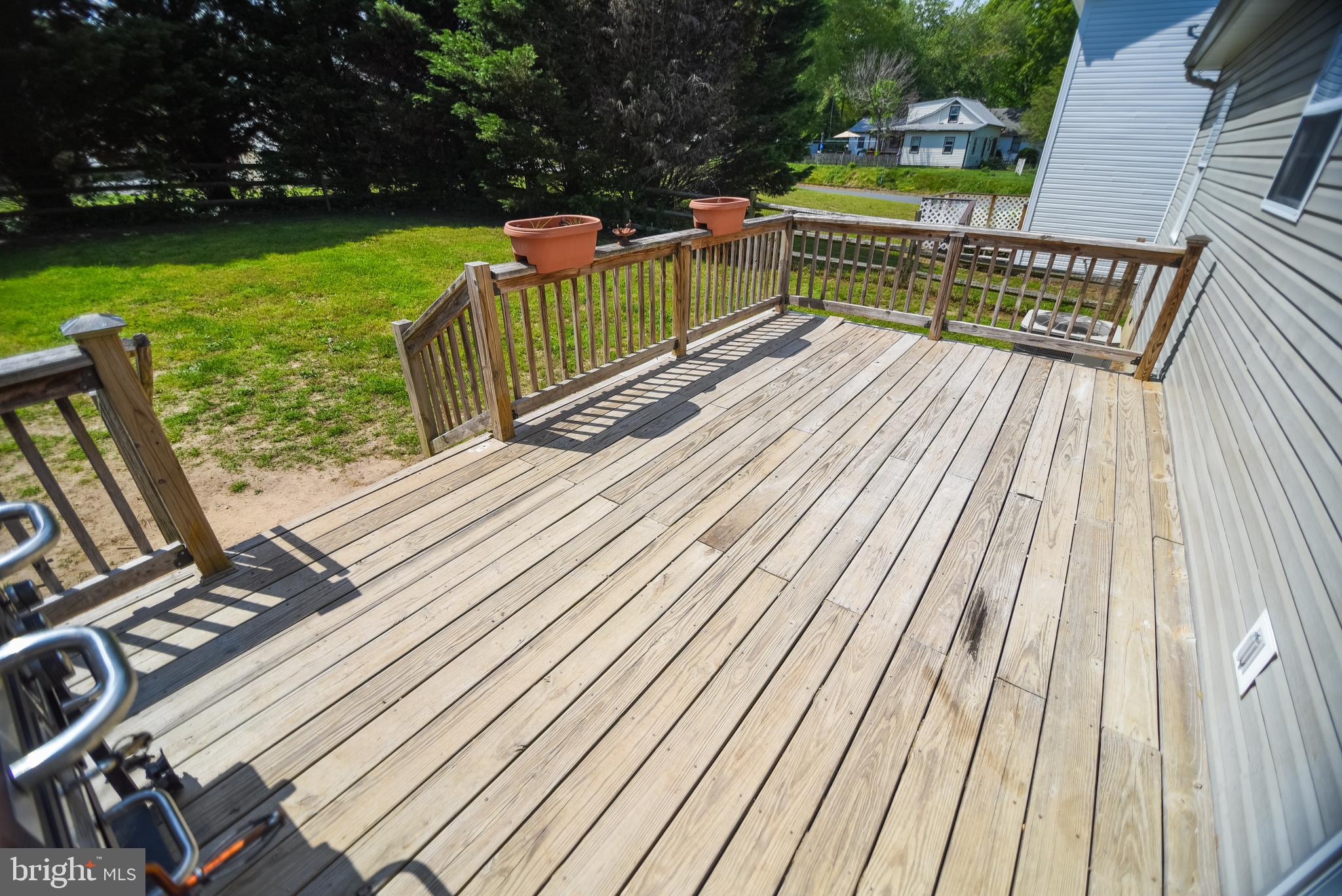 4777 St Leonard Road St. Leonard, MD 20685 - Photo 27 of 31 a view of a wooden deck with a yard