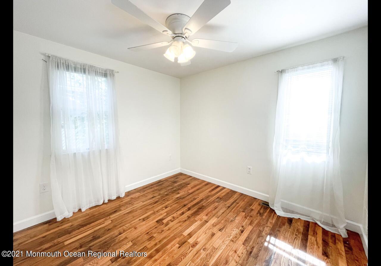 330 Front Street Union Beach, NJ 07735 - Photo 12 of 23 a view of empty room with window and ceiling fan