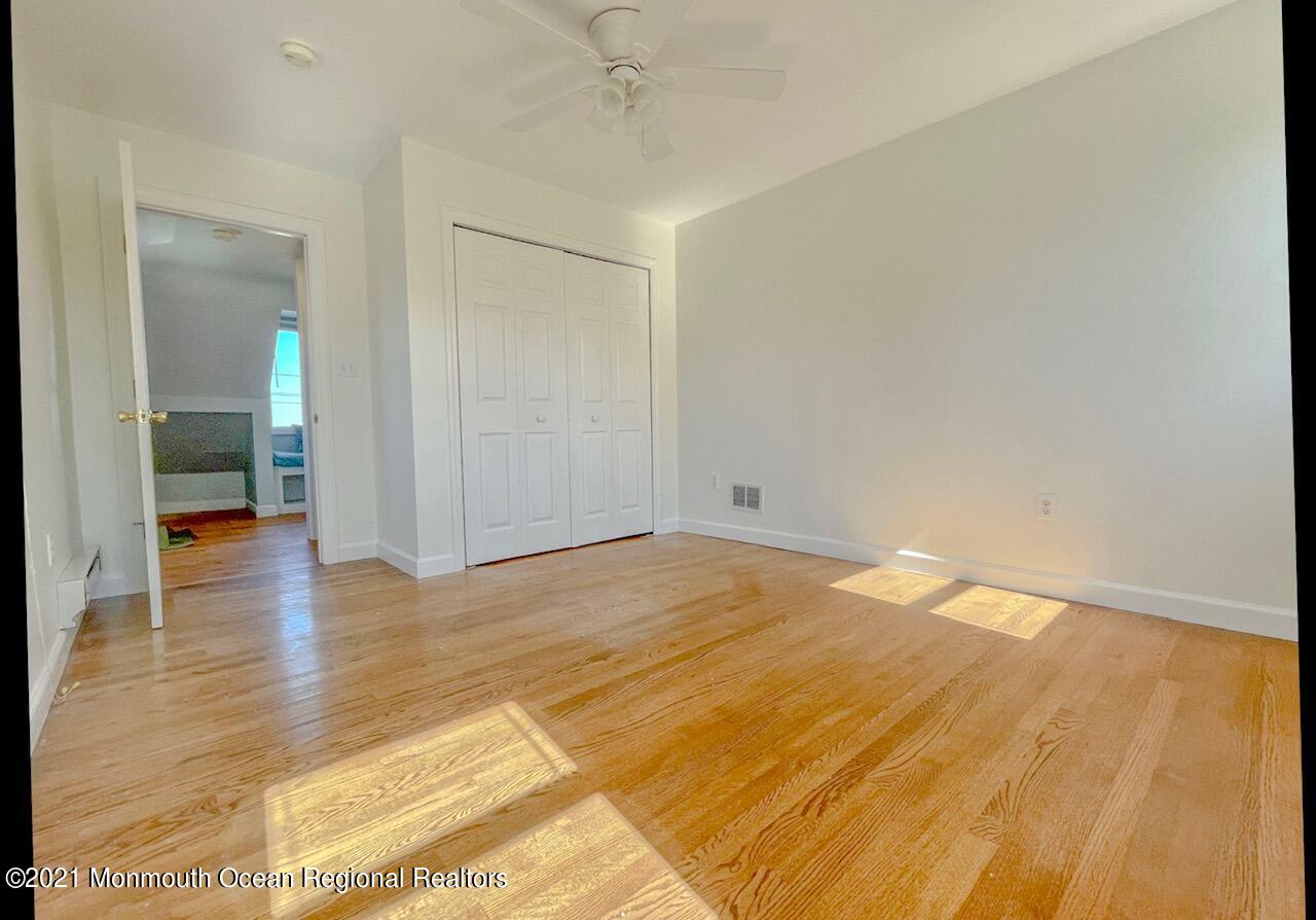 330 Front Street Union Beach, NJ 07735 - Photo 14 of 23 a view of empty room with wooden floor