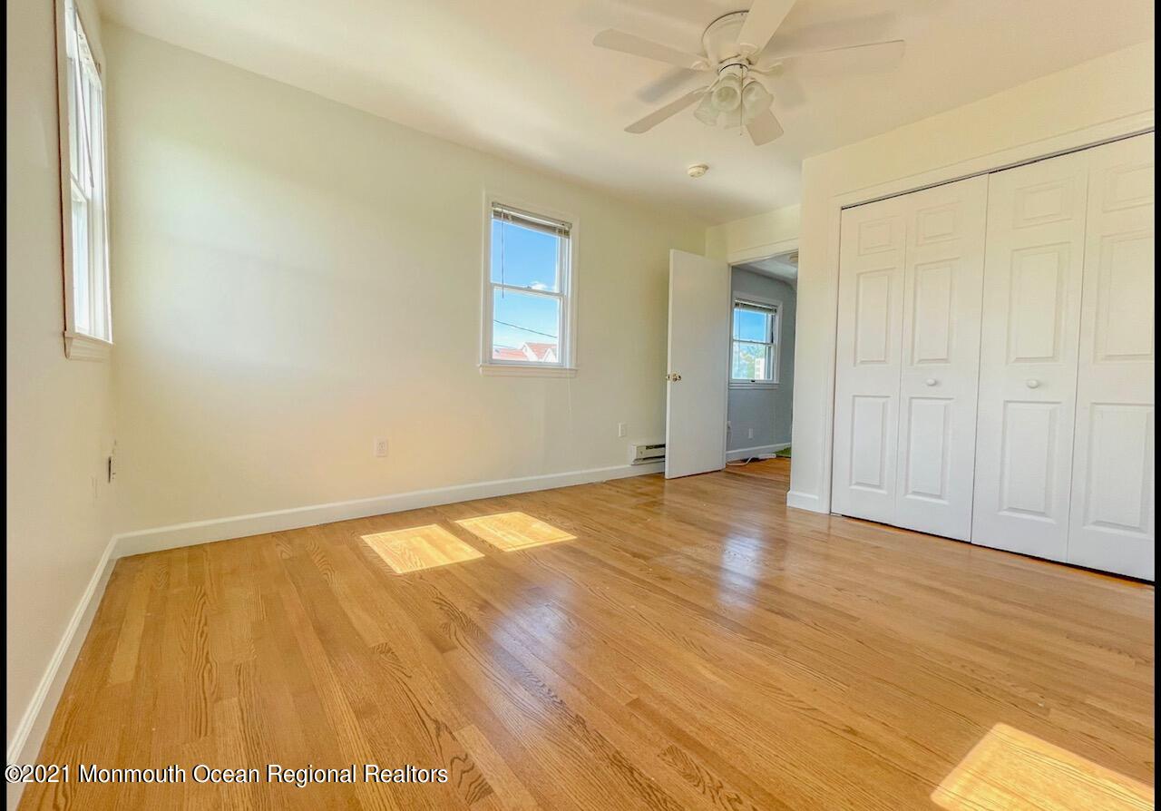 330 Front Street Union Beach, NJ 07735 - Photo 15 of 23 a view of an empty room with wooden floor