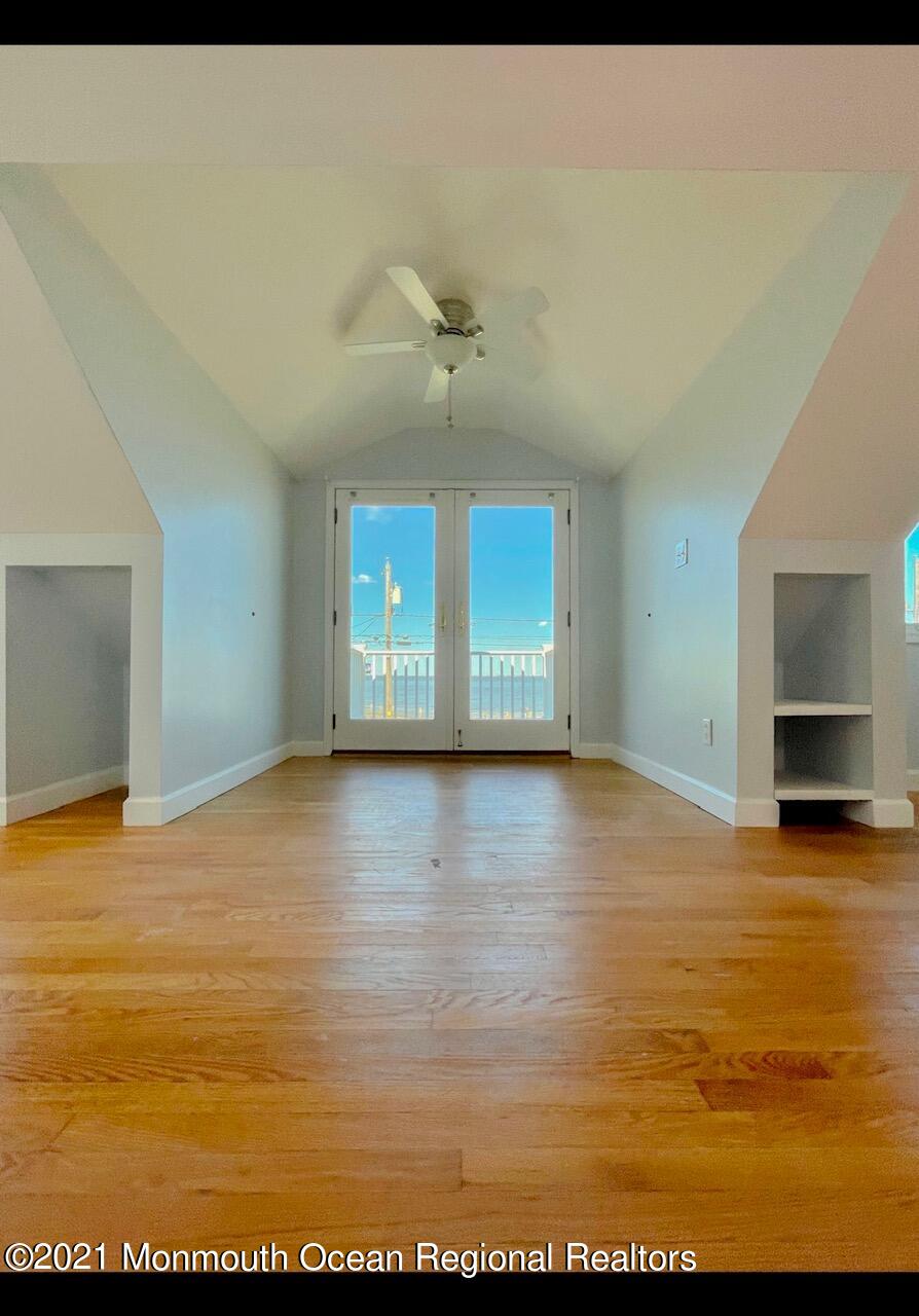 330 Front Street Union Beach, NJ 07735 - Photo 17 of 23 a view of an empty room with window and fire place