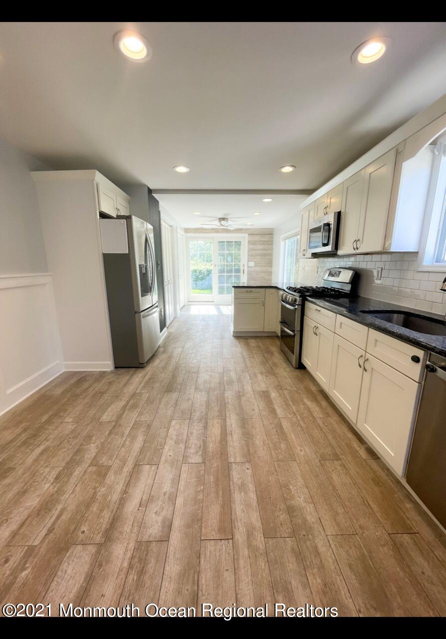 330 Front Street Union Beach, NJ 07735 - Photo 8 of 23 a view of kitchen with microwave and window