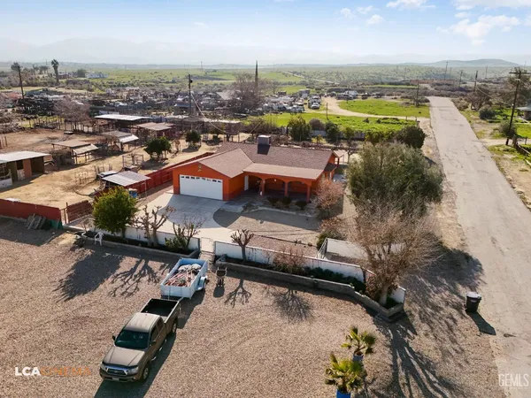 an aerial view of a house with a garden