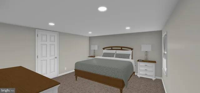 a bedroom with a large bed and a lamp