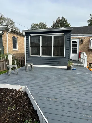 a front view of house with a garden