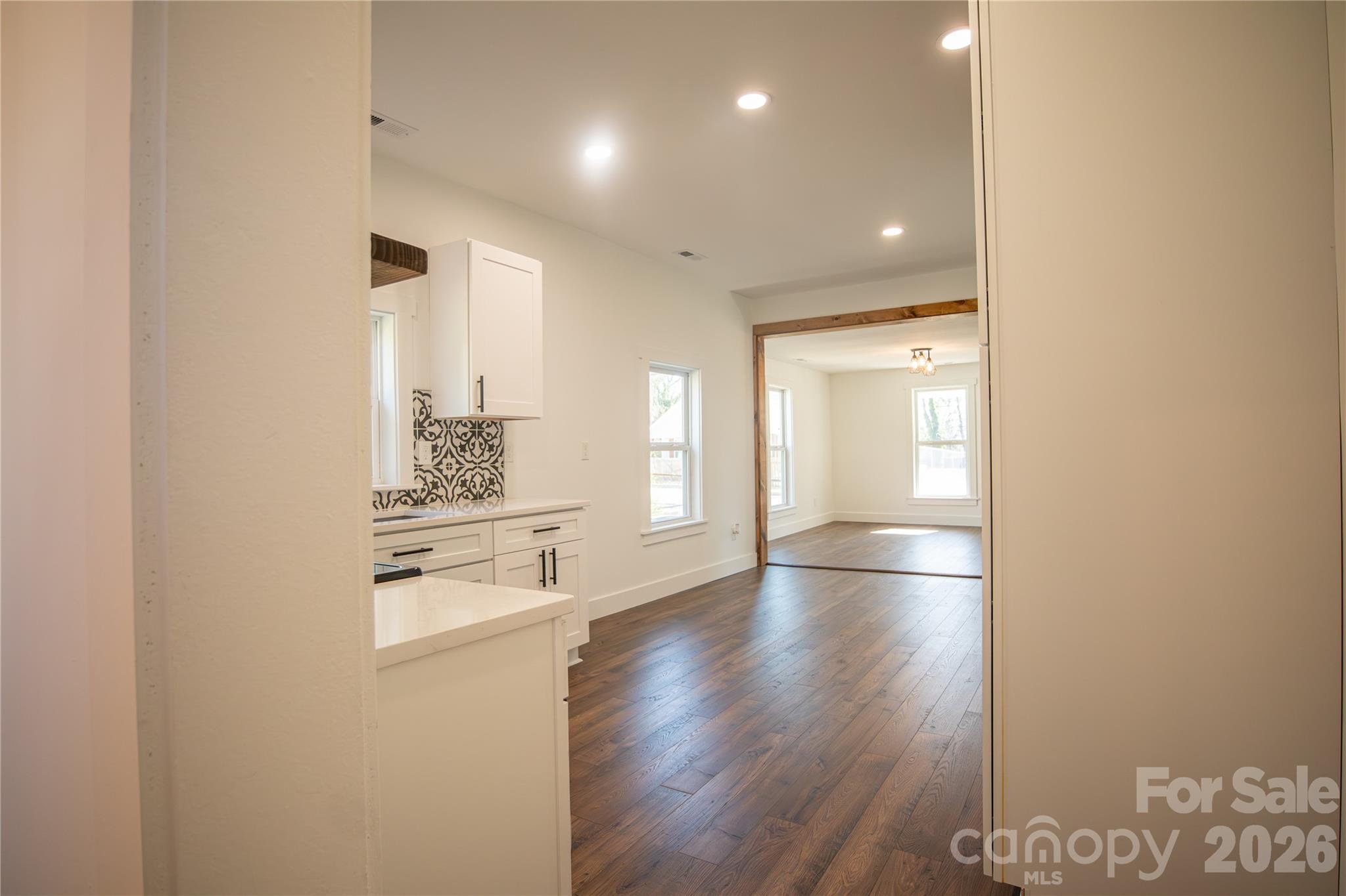 929 South Long Street Salisbury, NC 28144 - Photo 15 of 30 a view of kitchen and hall with wooden floor