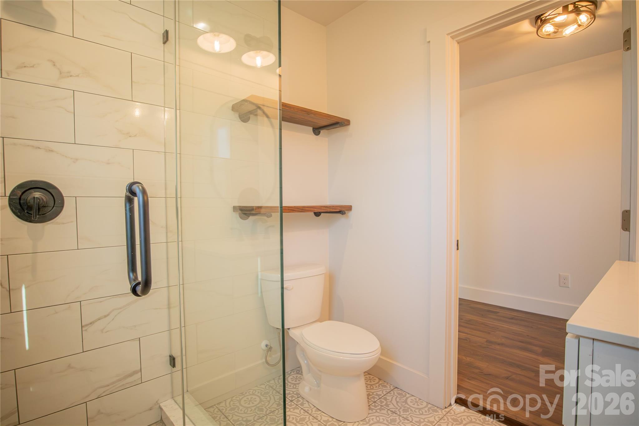 929 South Long Street Salisbury, NC 28144 - Photo 20 of 30 a bathroom with a toilet and a shower