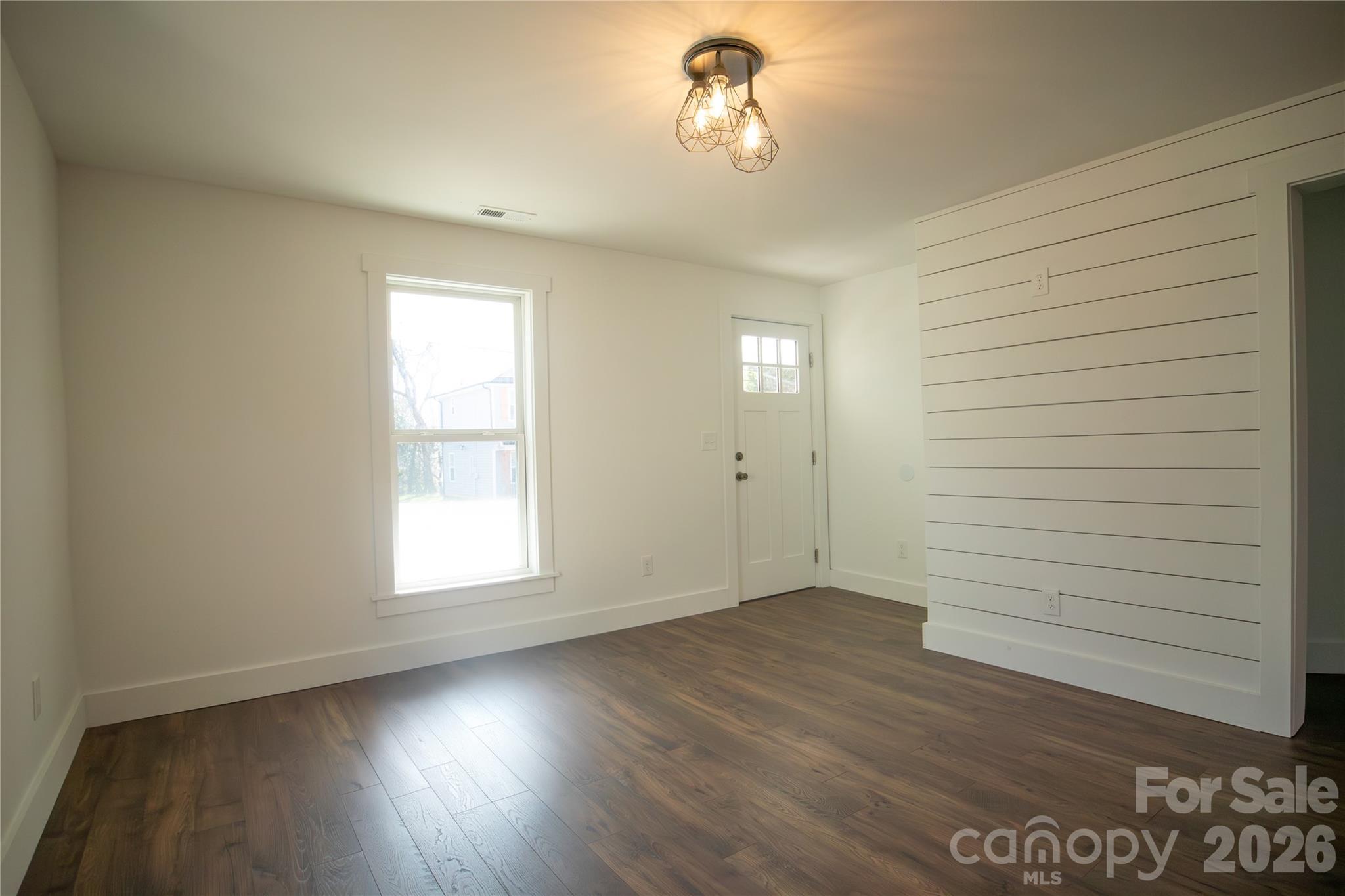 929 South Long Street Salisbury, NC 28144 - Photo 5 of 30 wooden floor in an empty room with a window