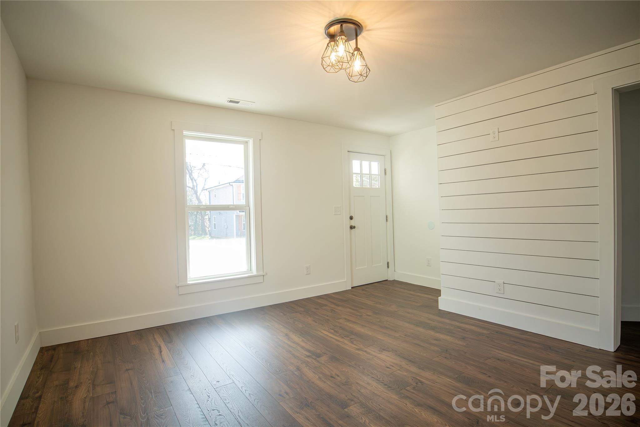 929 South Long Street Salisbury, NC 28144 - Photo 6 of 30 wooden floor in an empty room with a window
