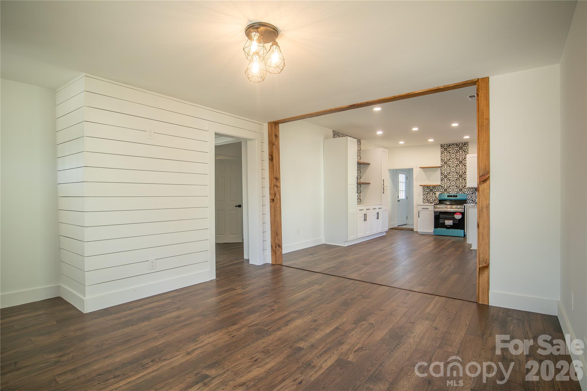 929 South Long Street Salisbury, NC 28144 - Photo 8 of 30 wooden floor in an empty room with a kitchen