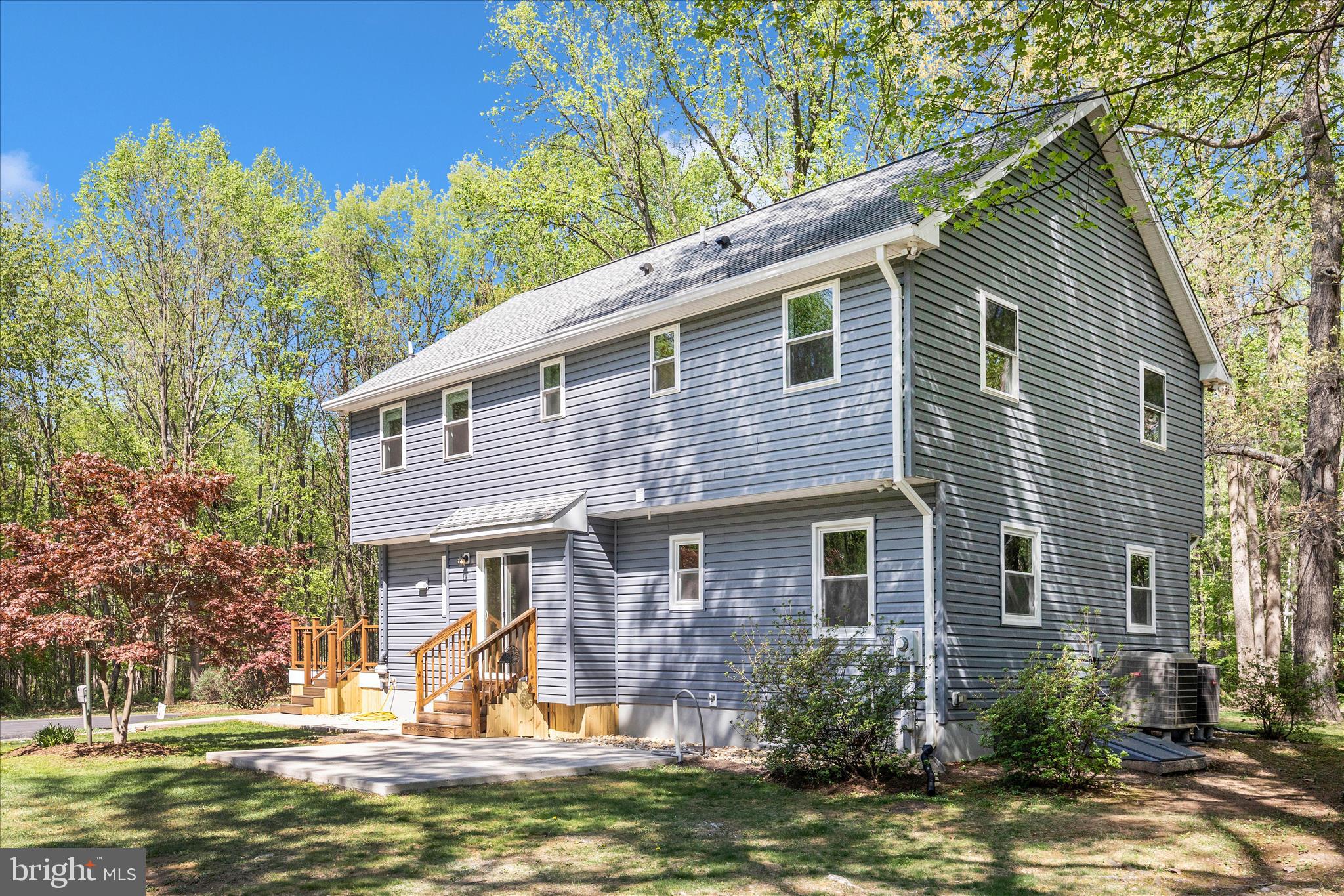 6518 Woodville Road Mount Airy, MD 21771 - Photo 42 of 53 a front view of a house with a yard
