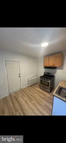 a view of kitchen with sink and microwave