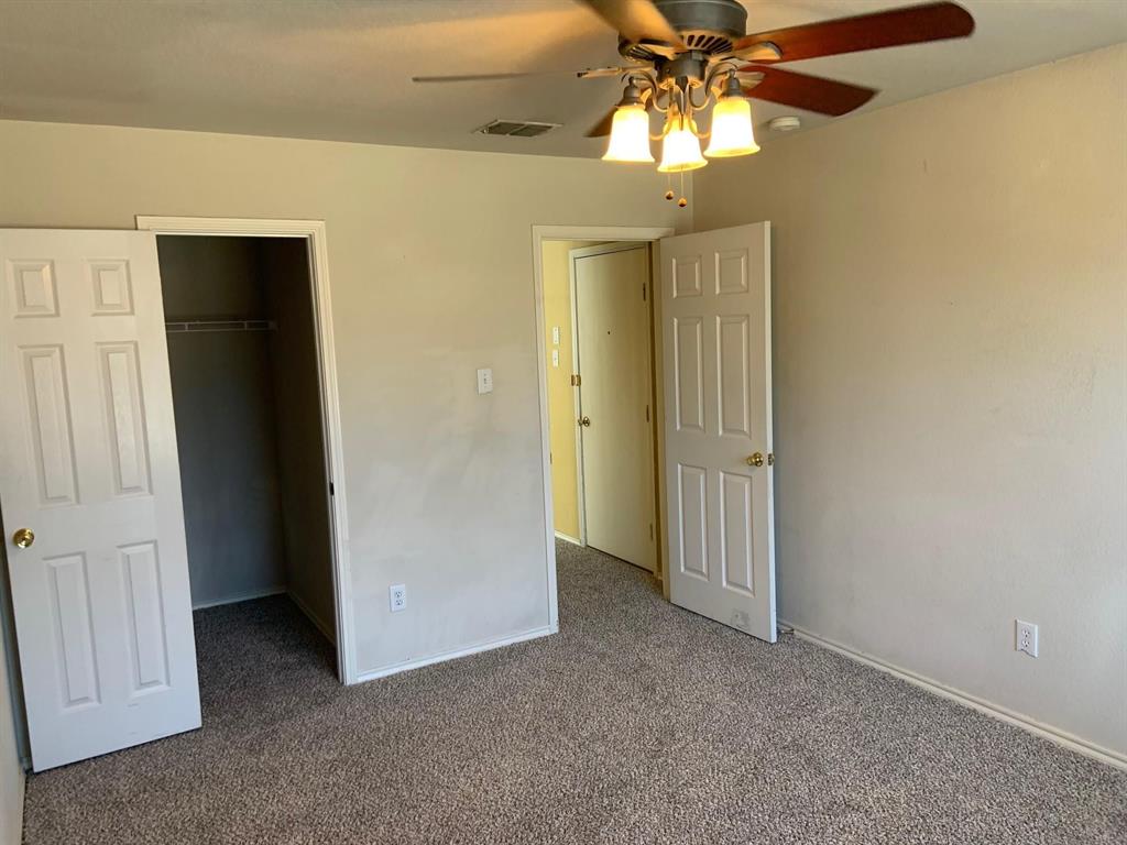 2620 Caprock Road McKinney, TX 75071 - Photo 9 of 19 Unfurnished bedroom with a spacious closet, carpet, and ceiling fan