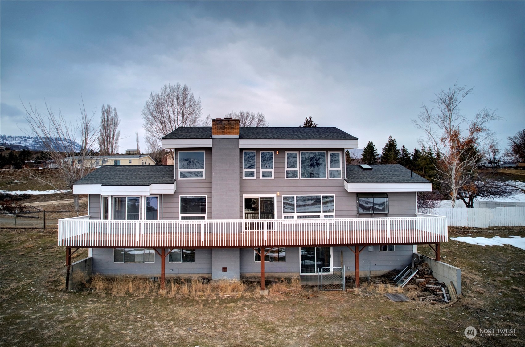 a view of a large building with a yard and sitting space