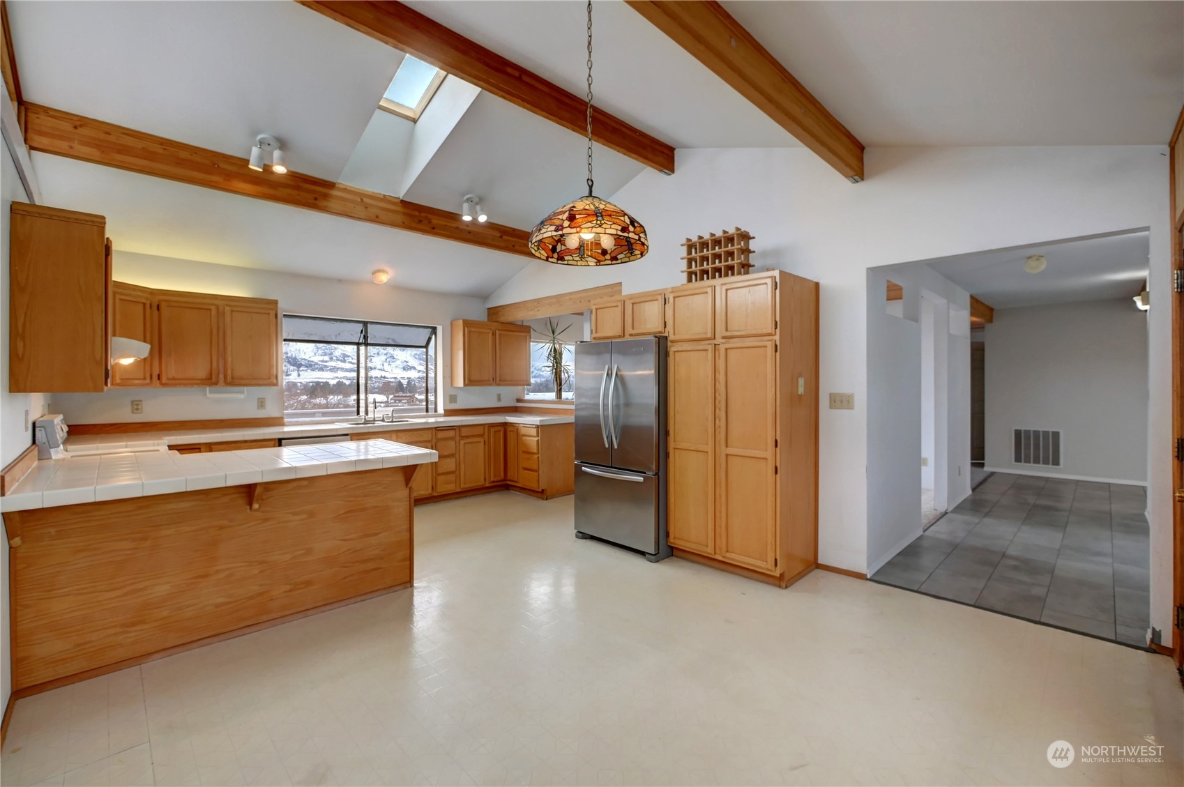 10 Sunrise Heights Road Malott, WA 98840 - Photo 17 of 40 a kitchen with refrigerator and cabinets