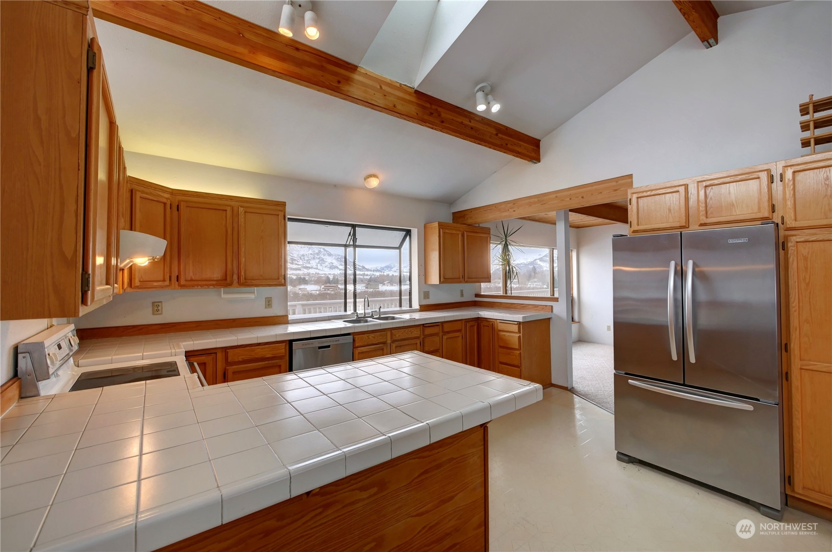 10 Sunrise Heights Road Malott, WA 98840 - Photo 20 of 40 a kitchen with stainless steel appliances granite countertop a sink and a refrigerator