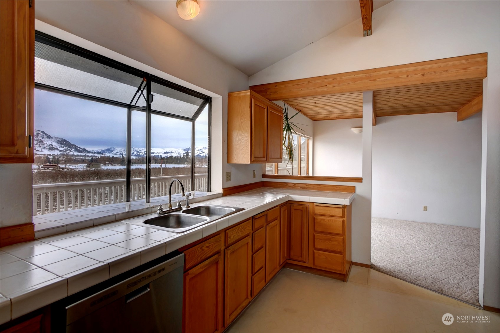 10 Sunrise Heights Road Malott, WA 98840 - Photo 21 of 40 a kitchen with granite countertop a sink and a counter top space