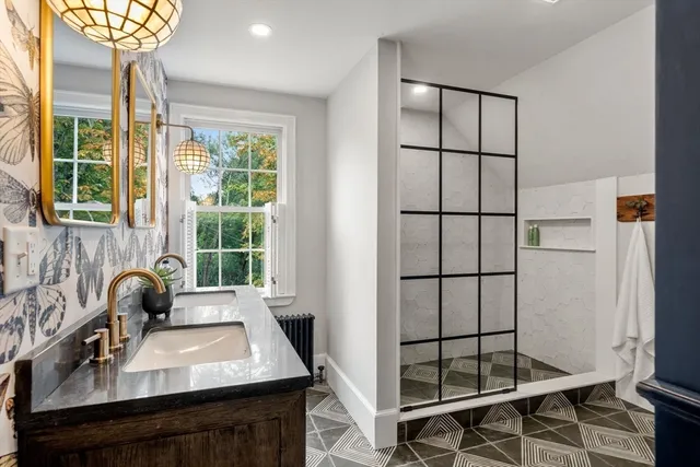 a view of a workspace room with a window