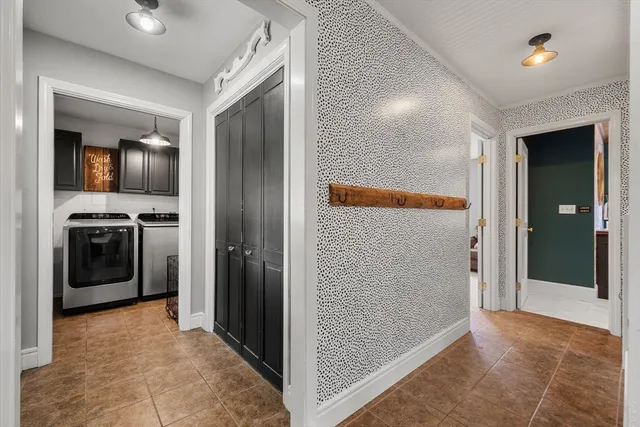 a view of a hallway with a living room