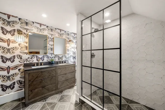 a bathroom with a shower and a sink