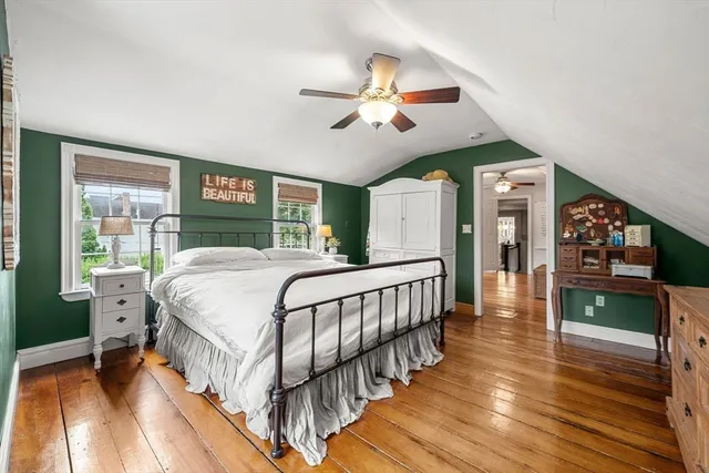 a bedroom with a bed and a view of bedroom