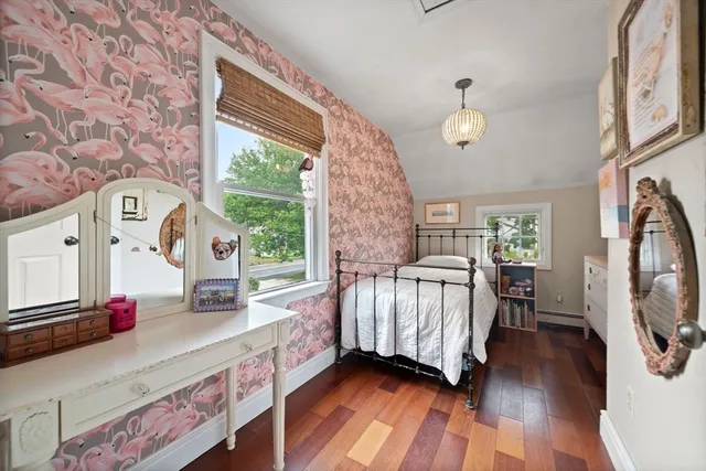 a bedroom with furniture and a window