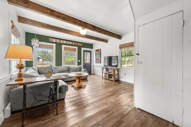 a living room with furniture and a table