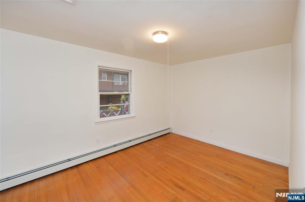 60 Poplar Avenue Hackensack, NJ 07601 - Photo 13 of 21 an empty room with a window
