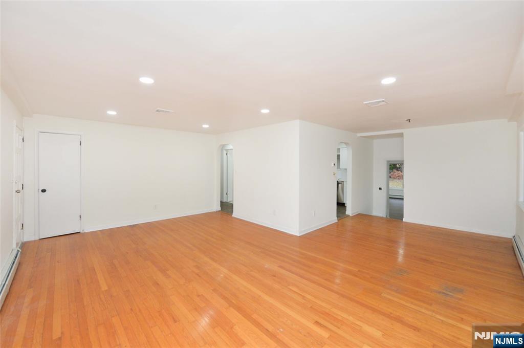 60 Poplar Avenue Hackensack, NJ 07601 - Photo 7 of 21 a large white bed in a room