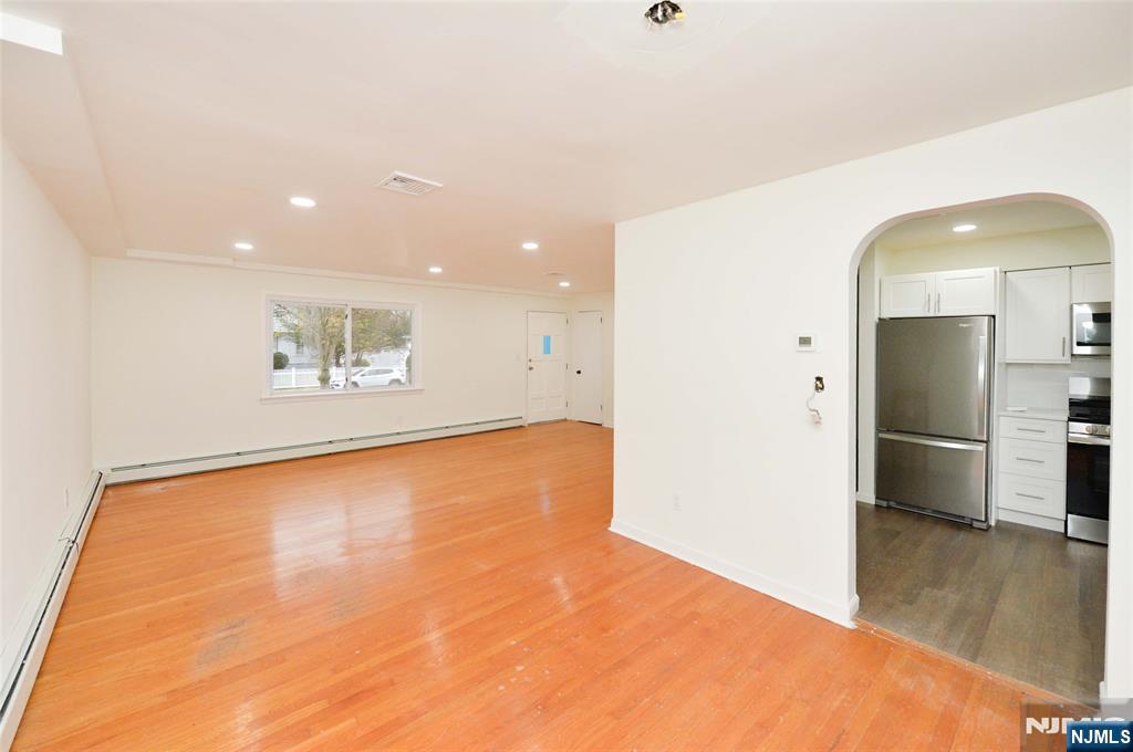 60 Poplar Avenue Hackensack, NJ 07601 - Photo 8 of 21 a view of empty room with wooden floor