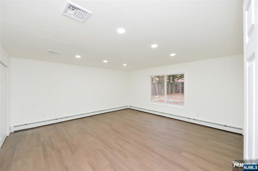 60 Poplar Avenue Hackensack, NJ 07601 - Photo 9 of 21 an empty room with a workbench