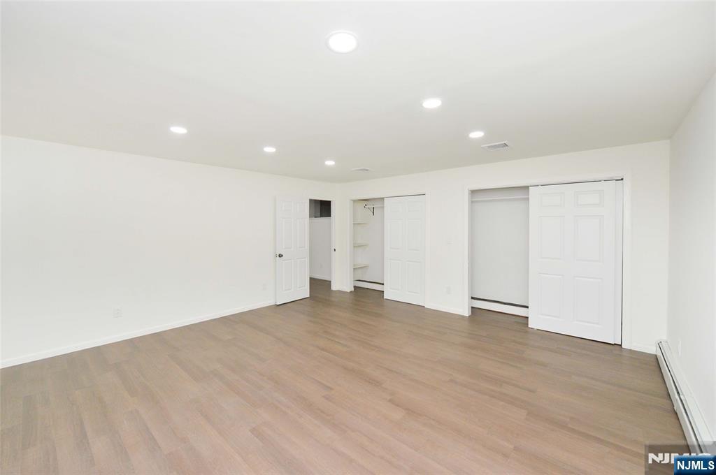 60 Poplar Avenue Hackensack, NJ 07601 - Photo 10 of 21 a view of an empty room with wooden floor