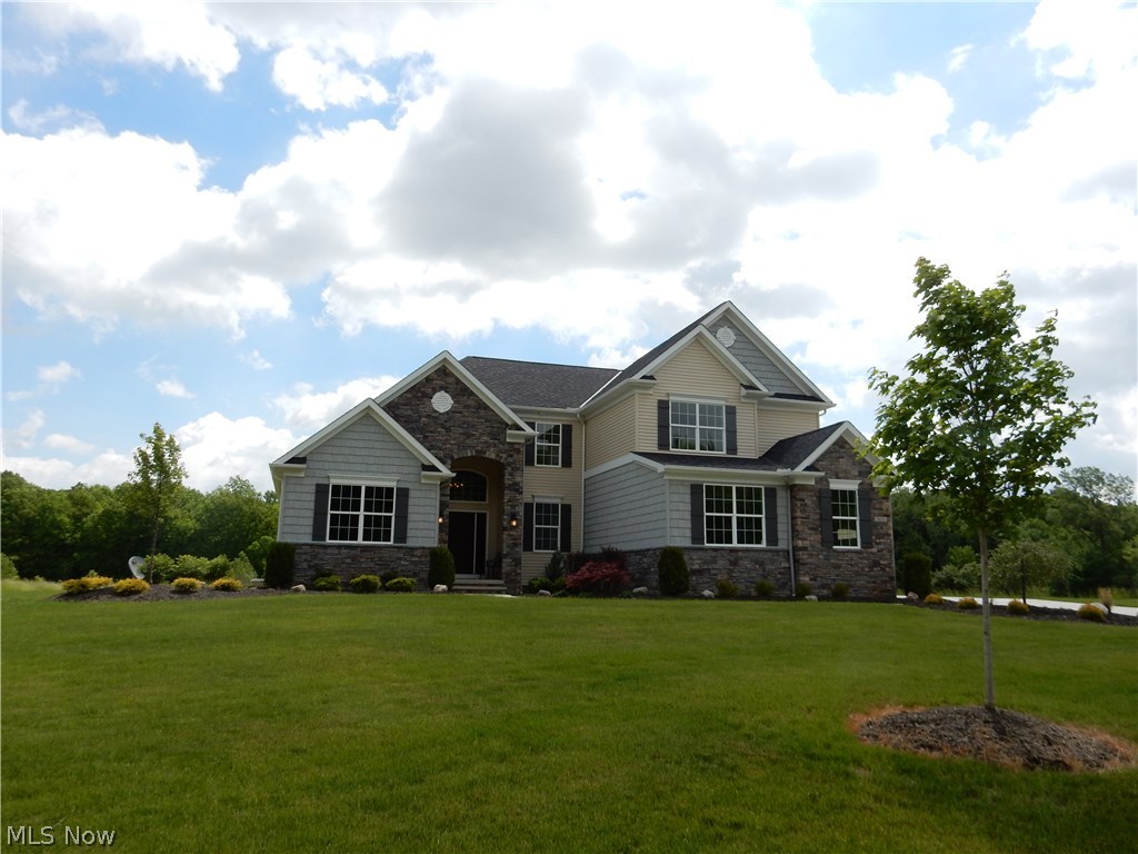 7623 Rimrock Road Medina, OH 44256 - Photo 1 of 20 Custom 1st floor master situated on a beautiful 2 acre cul-de-sac lot in Liverpool Twp! Stunning gourmet kitchen offers SS Electrolux Icon appliances, Granite counters, tile backsplash, upgraded cabinets, custom pantry, large dining space & wood floors that carry through great room! Oversized kitchen island with seating is perfect for entertaining! Spacious 2 story great room accented by floor to ceiling stone fireplace. Spacious master suite w/vaulted ceiling, large walk-in closet & glamour bath featuring