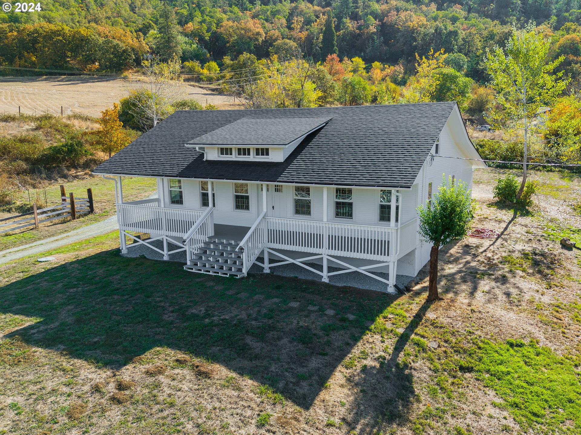754 Glenbrook Loop Road Riddle, OR 97469 - Photo 1 of 45 a aerial view of a house with garden