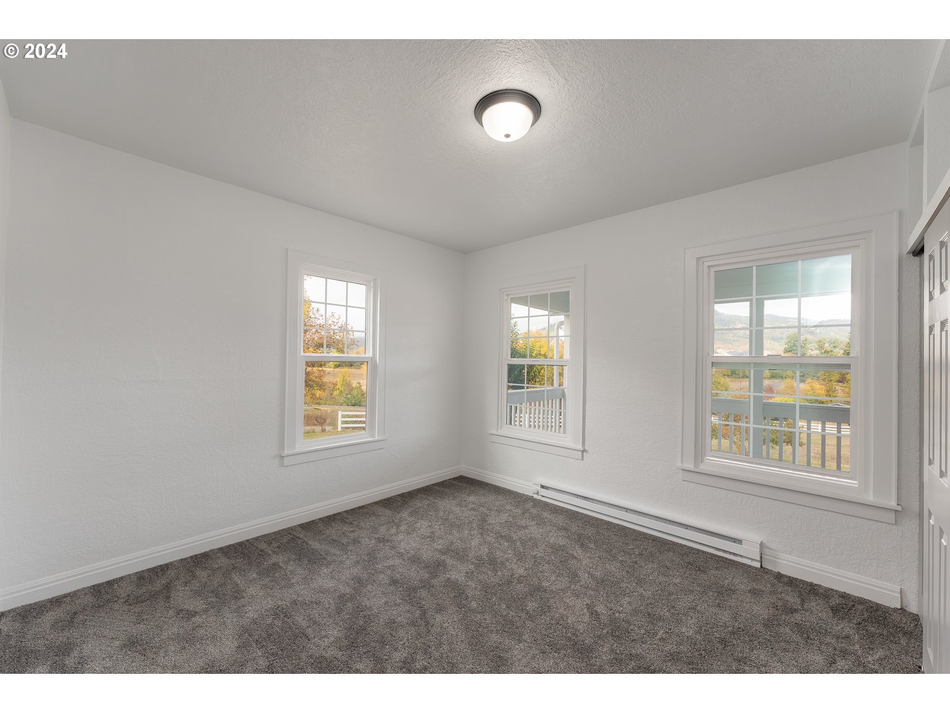 754 Glenbrook Loop Road Riddle, OR 97469 - Photo 19 of 45 a view of an empty room with a window