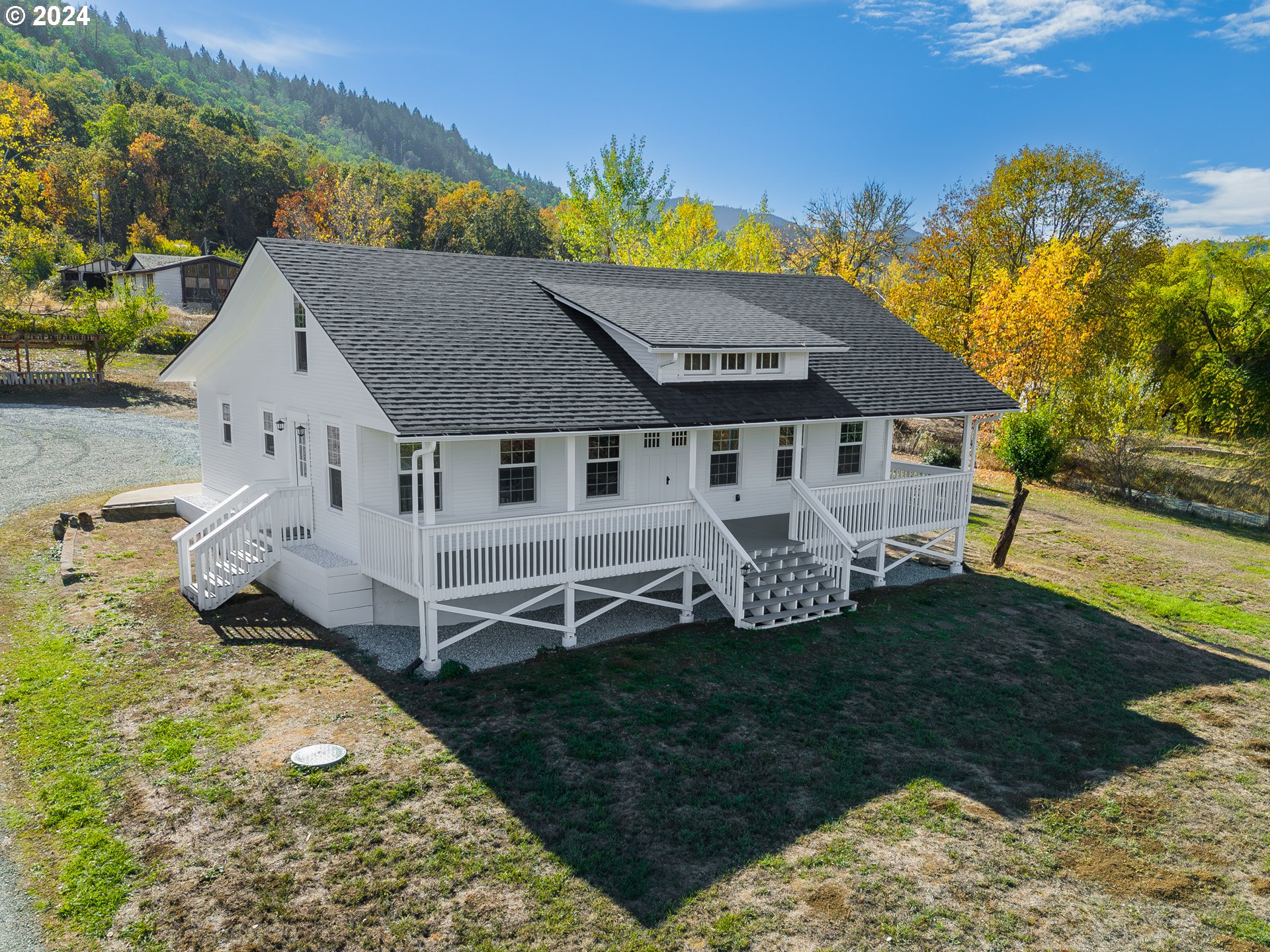 754 Glenbrook Loop Road Riddle, OR 97469 - Photo 2 of 45 an aerial view of a house with a garden