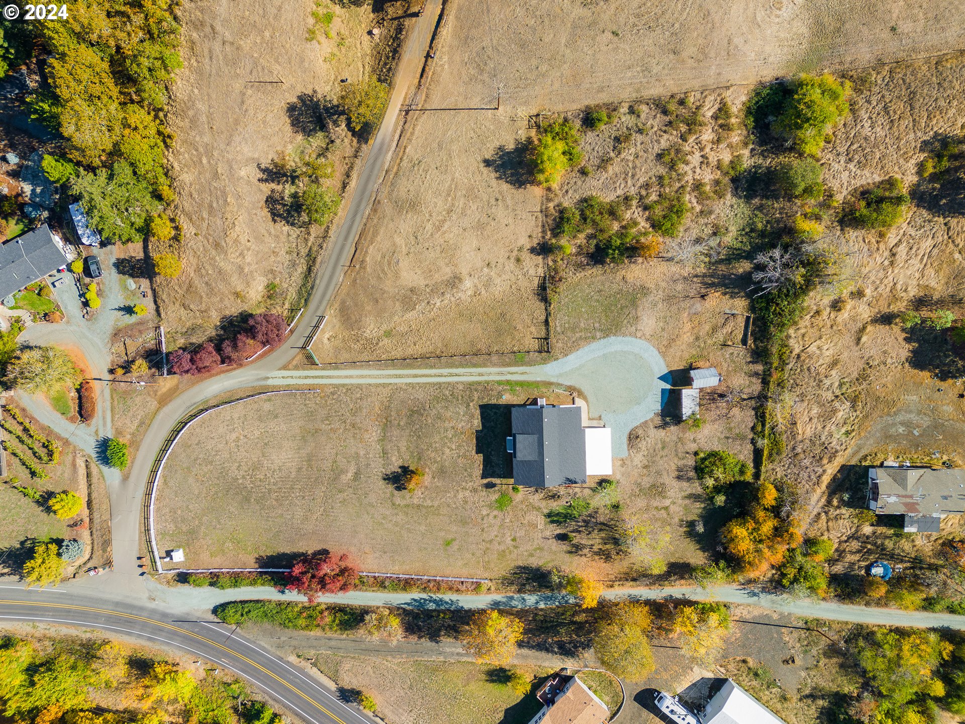 754 Glenbrook Loop Road Riddle, OR 97469 - Photo 32 of 45 an aerial view of a house with swimming pool