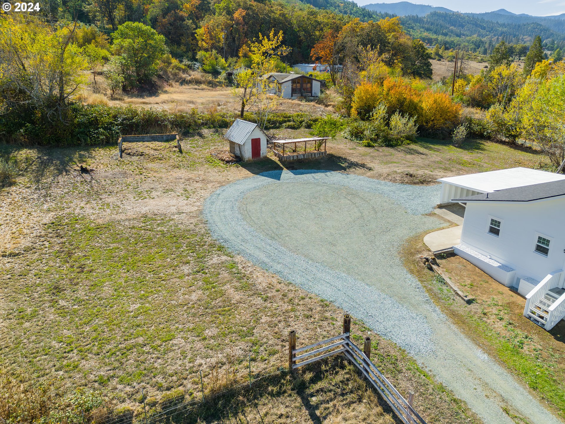 754 Glenbrook Loop Road Riddle, OR 97469 - Photo 36 of 45 a view of a backyard with lawn chairs