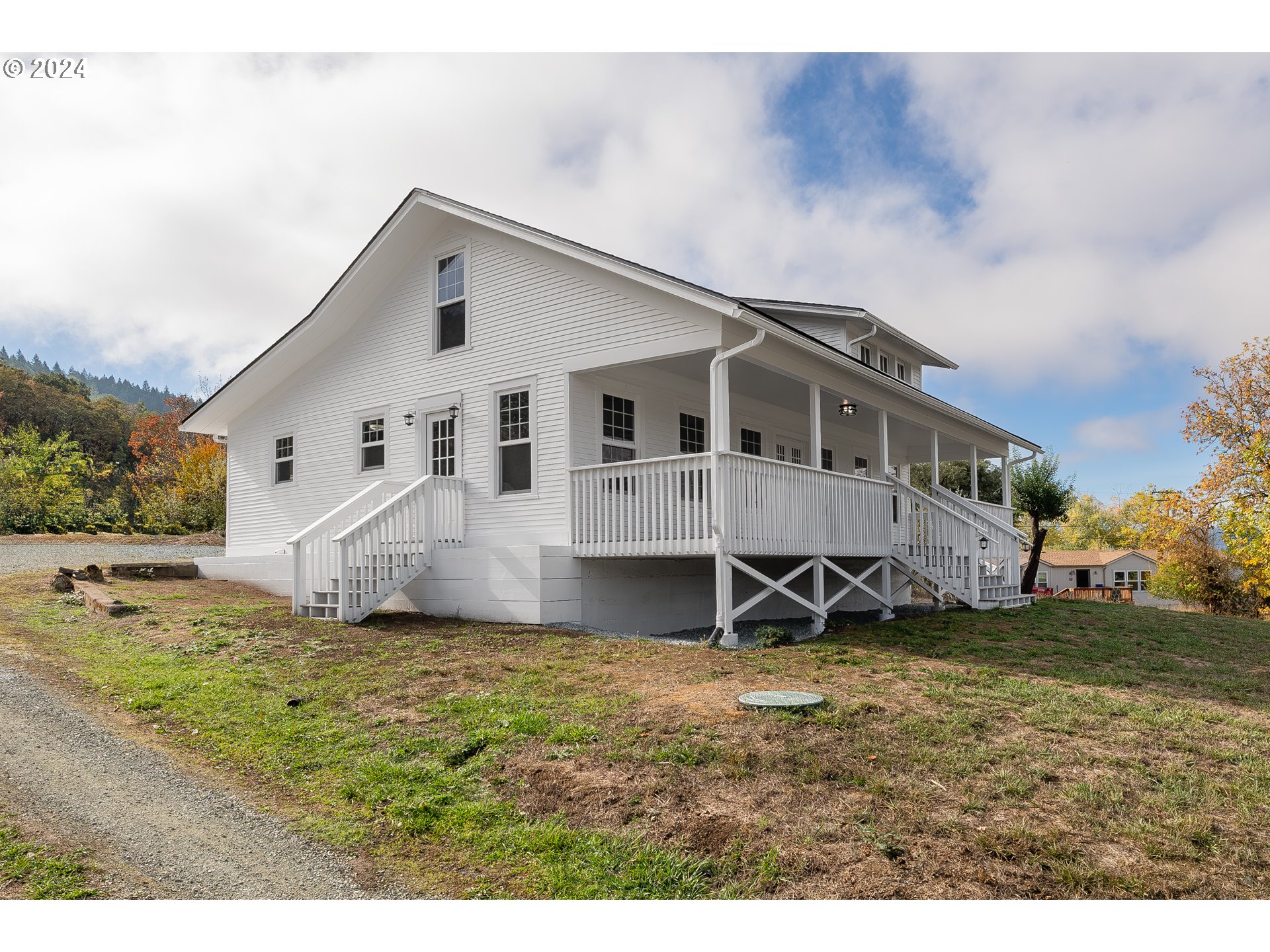 754 Glenbrook Loop Road Riddle, OR 97469 - Photo 4 of 45 a view of a house with a yard